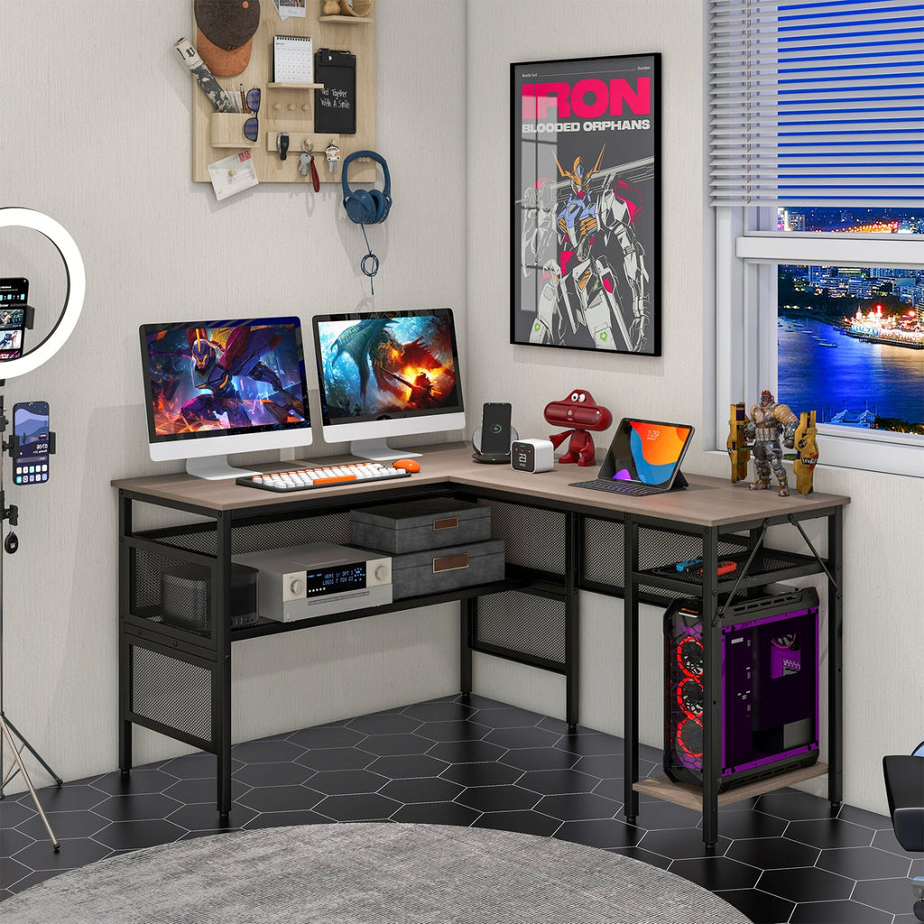 L-shaped computer desk with gray tabletop, black frame, open storage shelves and drawers