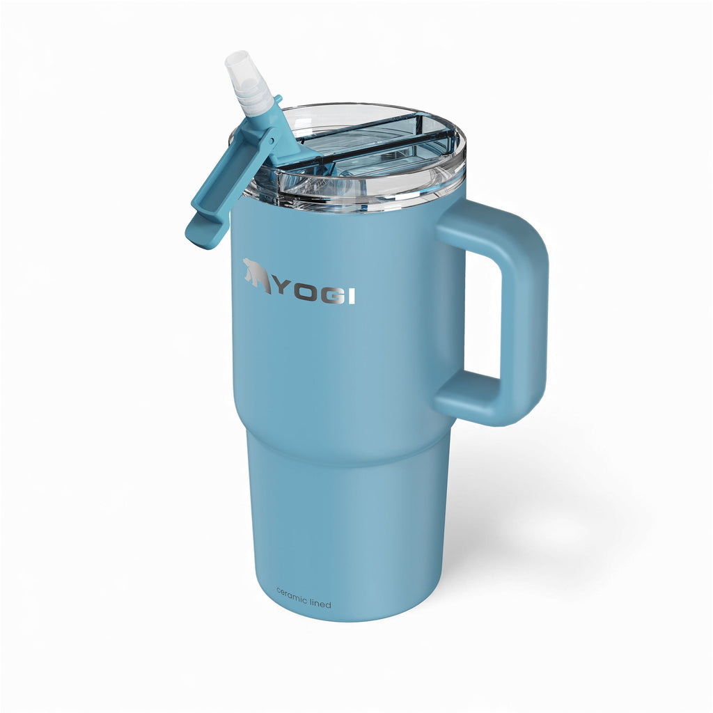 Ceramic-lined evolution tumbler in teal blue with clear open top and straw spout