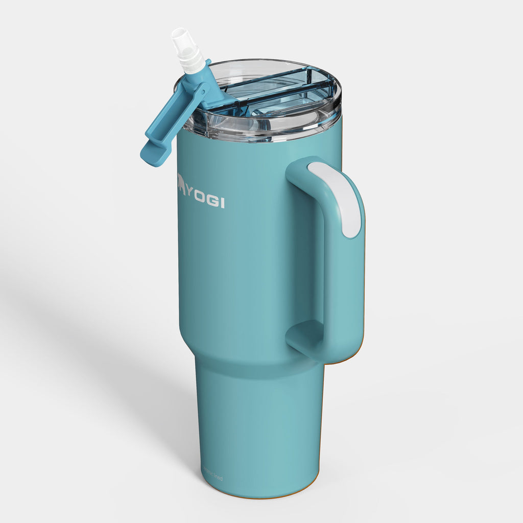 Ceramic-lined tumbler in blue with side handle and clear lid, lid open.