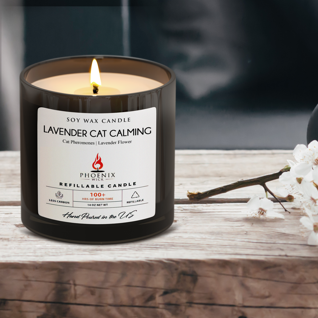 Lavender cat calming refillable candle in black jar, label visible with flame