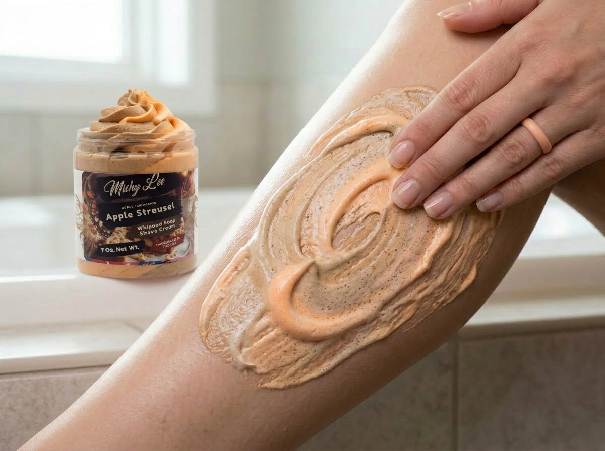 Beige whipped soap applied to arm with small whipped soap jar in view