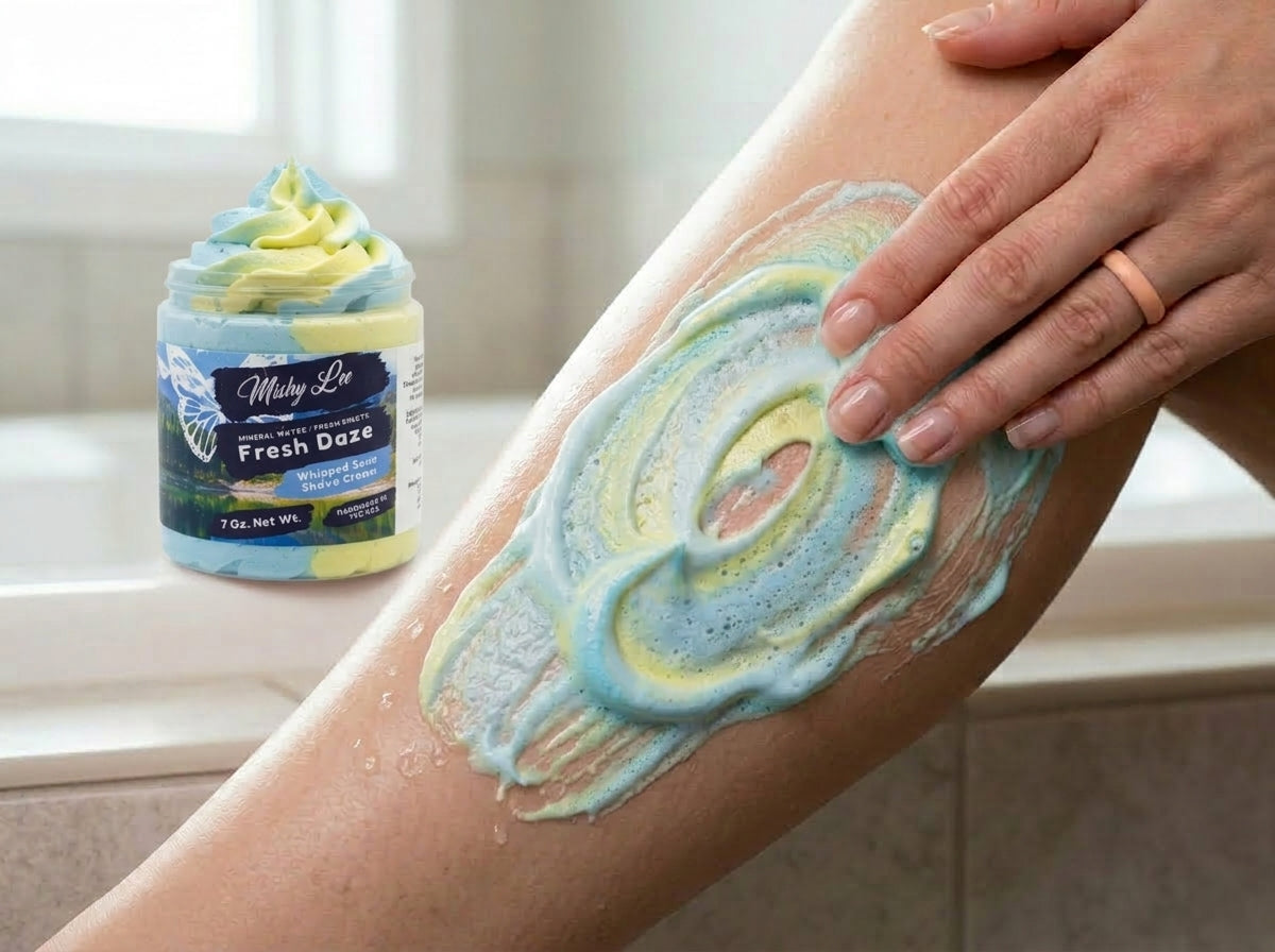 Blue and yellow whipped soap and shave cream spread on forearm skin