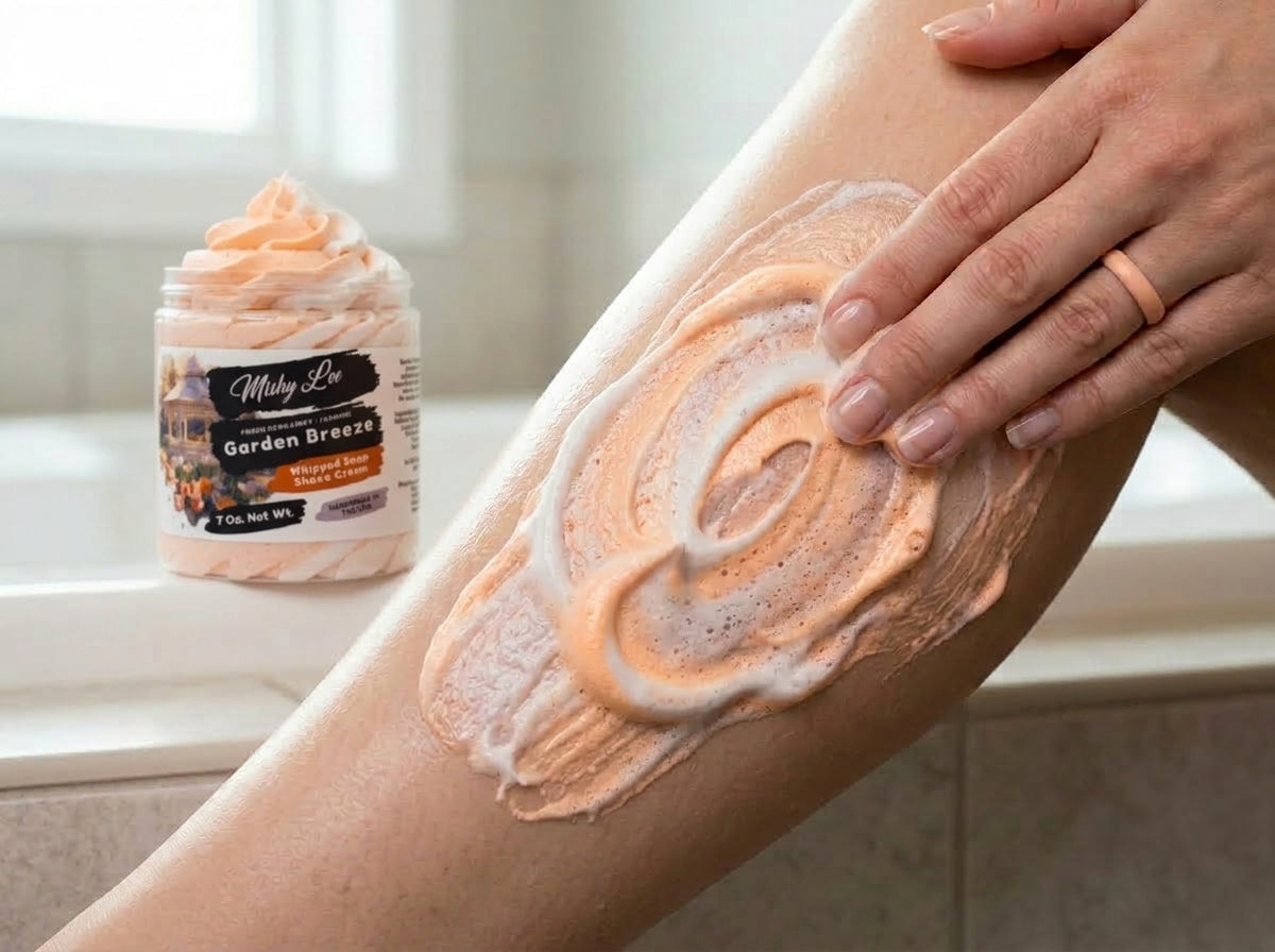 Hand applying peach whipped soap and shave cream foam to arm