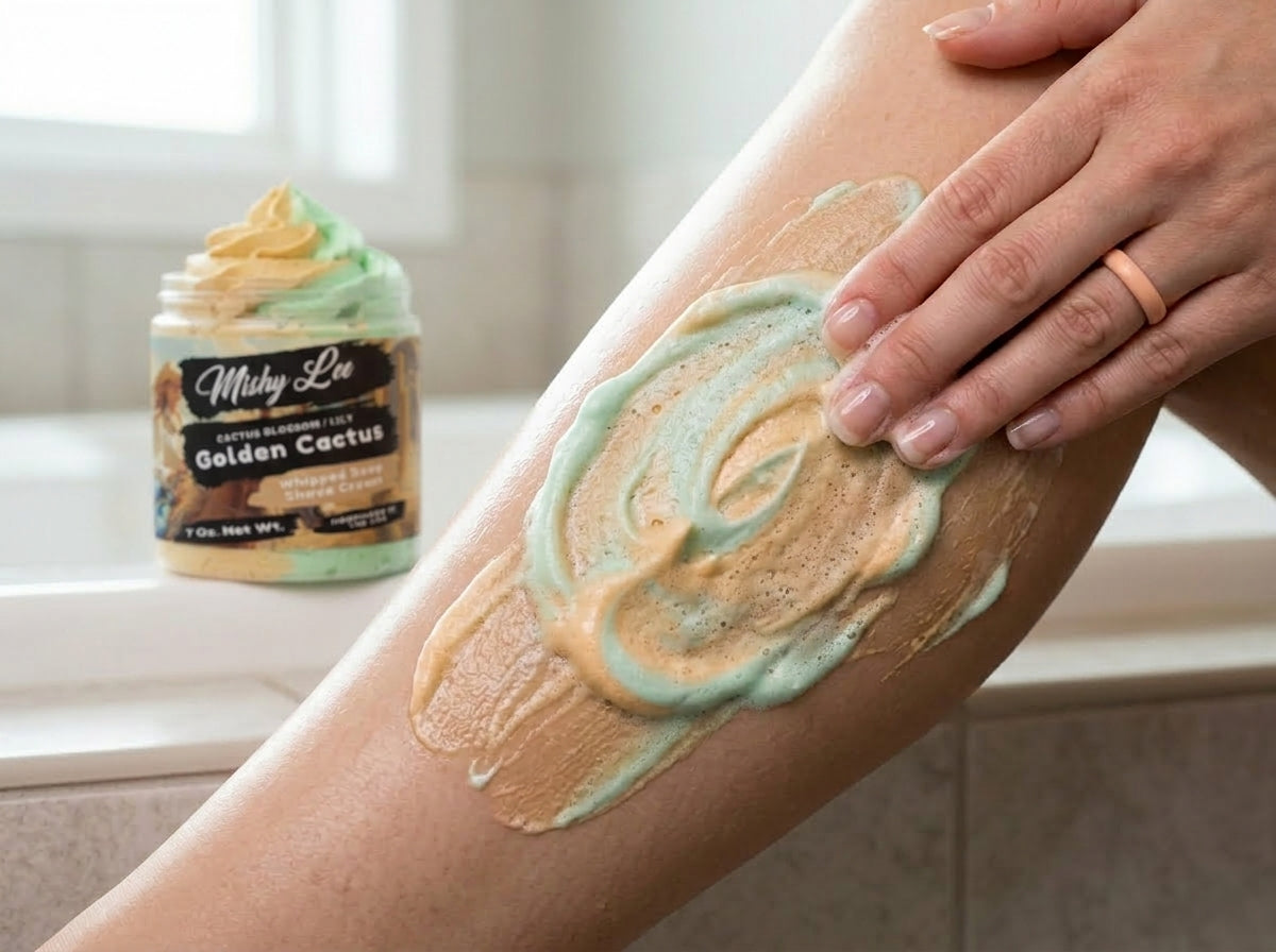 Whipped soap and shave cream lather on skin with gold-and-green swirl pattern