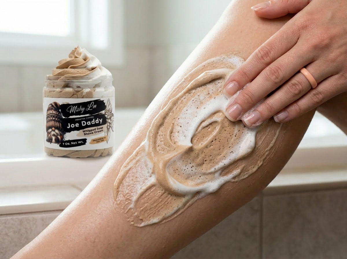 Whipped soap and shave cream on skin, with hands applying foam