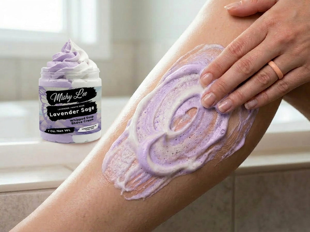 Purple whipped soap and shave cream spread on skin by a hand