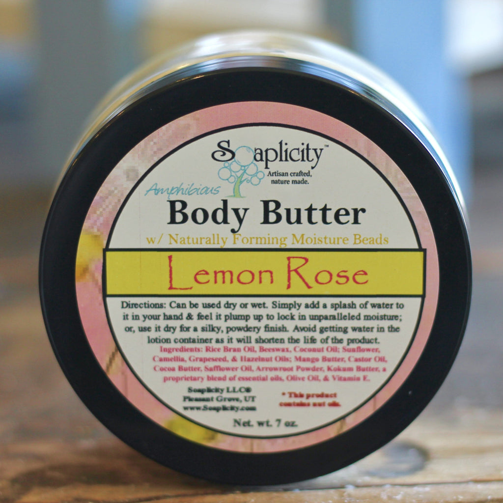 Body butter jar with black lid and Lemon Rose label facing camera