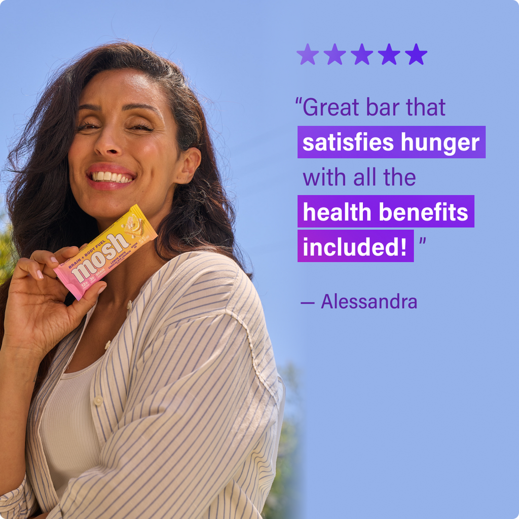 Mosh energy bar wrapper held by a smiling woman