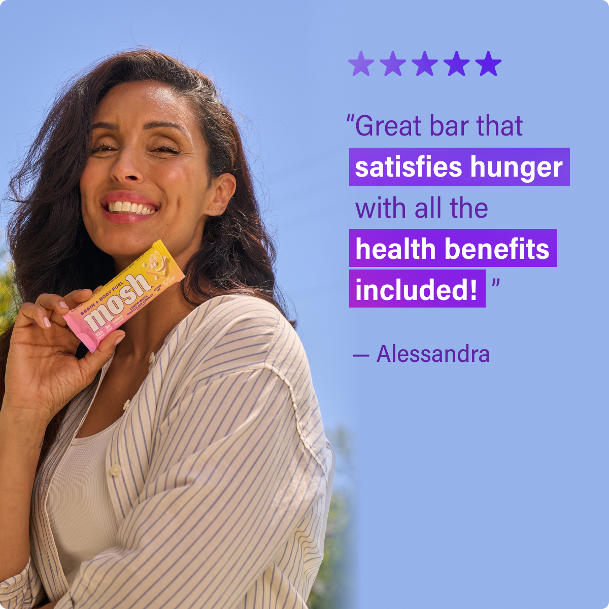 Mosh energy bar wrapper held by a smiling woman