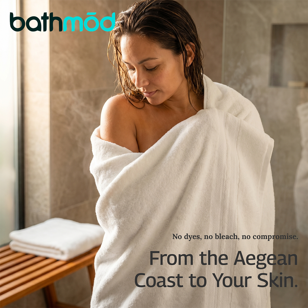 White bath towel draped over shoulders on a person, plush terry texture