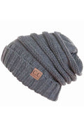 Dark grey slouchy knitted beanie with ribbed texture and C.C. leather patch logo