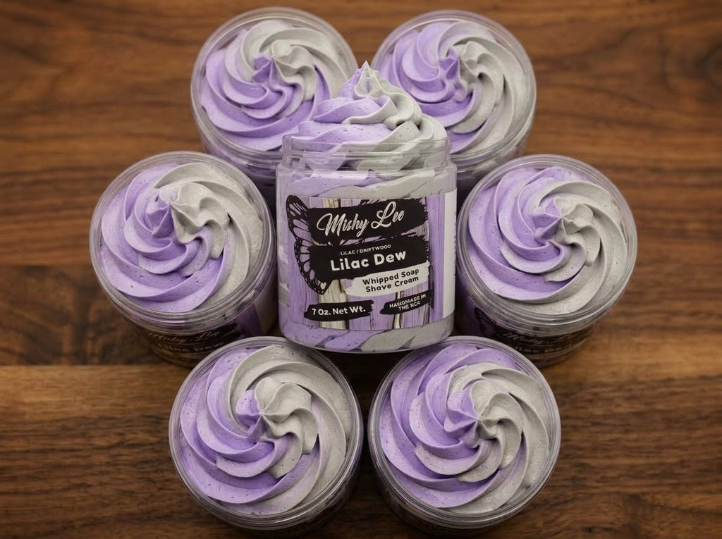 Lilac Dew whipped soap and shave cream jar surrounded by small swirled tubs
