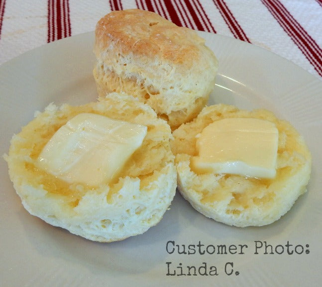Gluten-free flour biscuits with butter on white plate