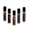 Mini perfume gift set with five travel-size bottles, black caps and gold atomizers