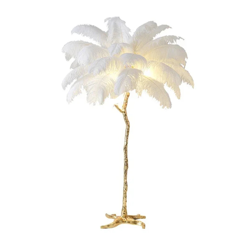 White ostrich feather LED floor lamp with gold stand, tripod base, and feather shade