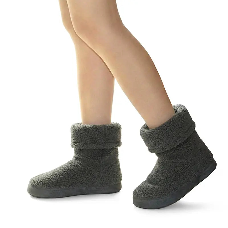 Women wearing grey fuzzy ankle boot slippers with folded top and dark sole