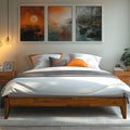 Wood bed frame with white bedding and orange pillow accent, slatted base
