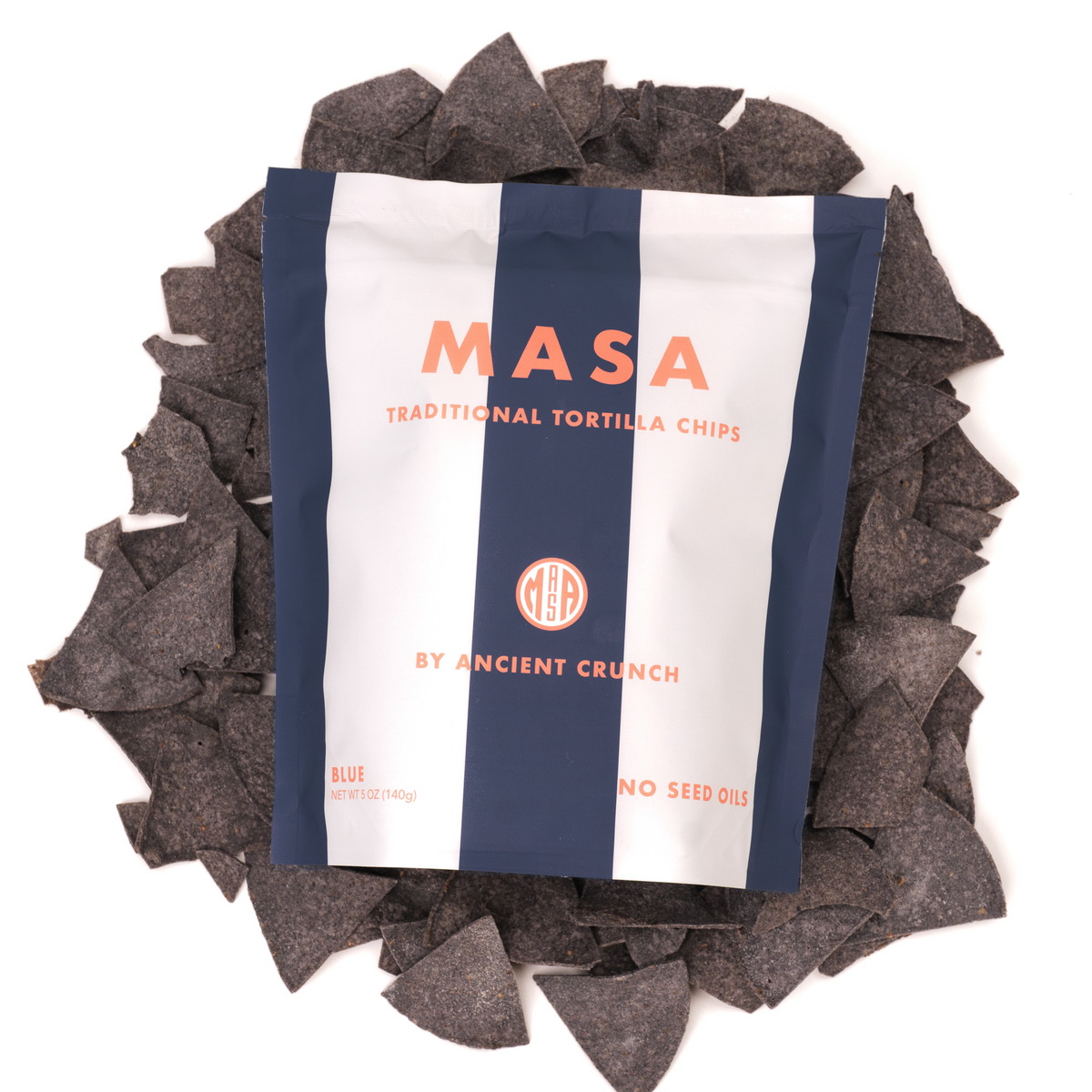 MASA traditional tortilla chips bag with dark chips scattered around
