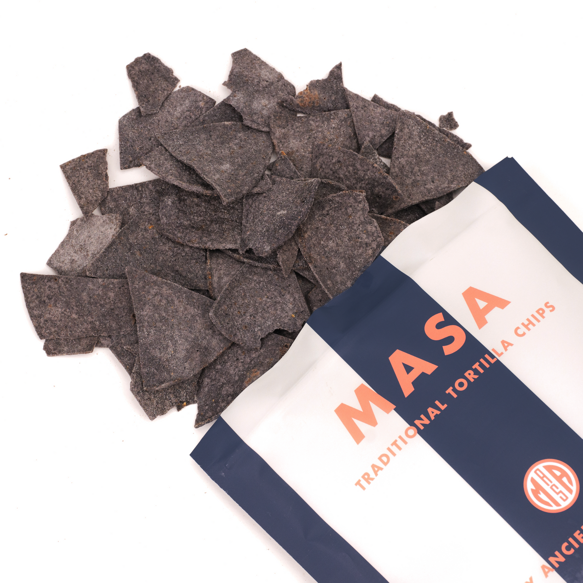 MASA tortilla chips bag with scattered dark tortilla chips