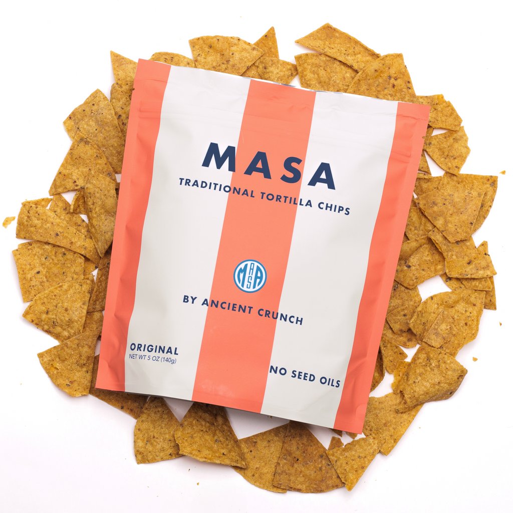 MASA Original tortilla chips bag with tortilla chips scattered around it