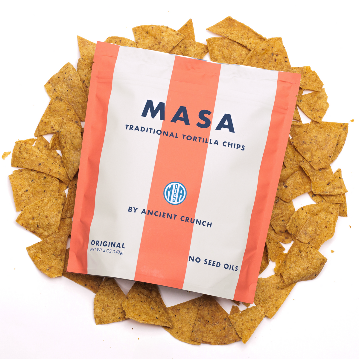MASA Original tortilla chips bag with tortilla chips scattered around it