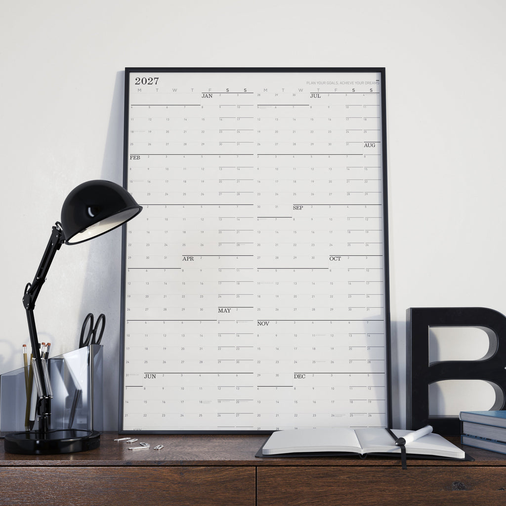 Large wall calendar with 2027 monthly grid and black binding, landscape layout