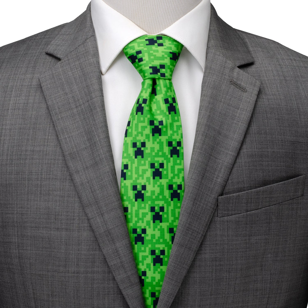 Green pixel camouflage necktie worn with dark suit jacket and white shirt