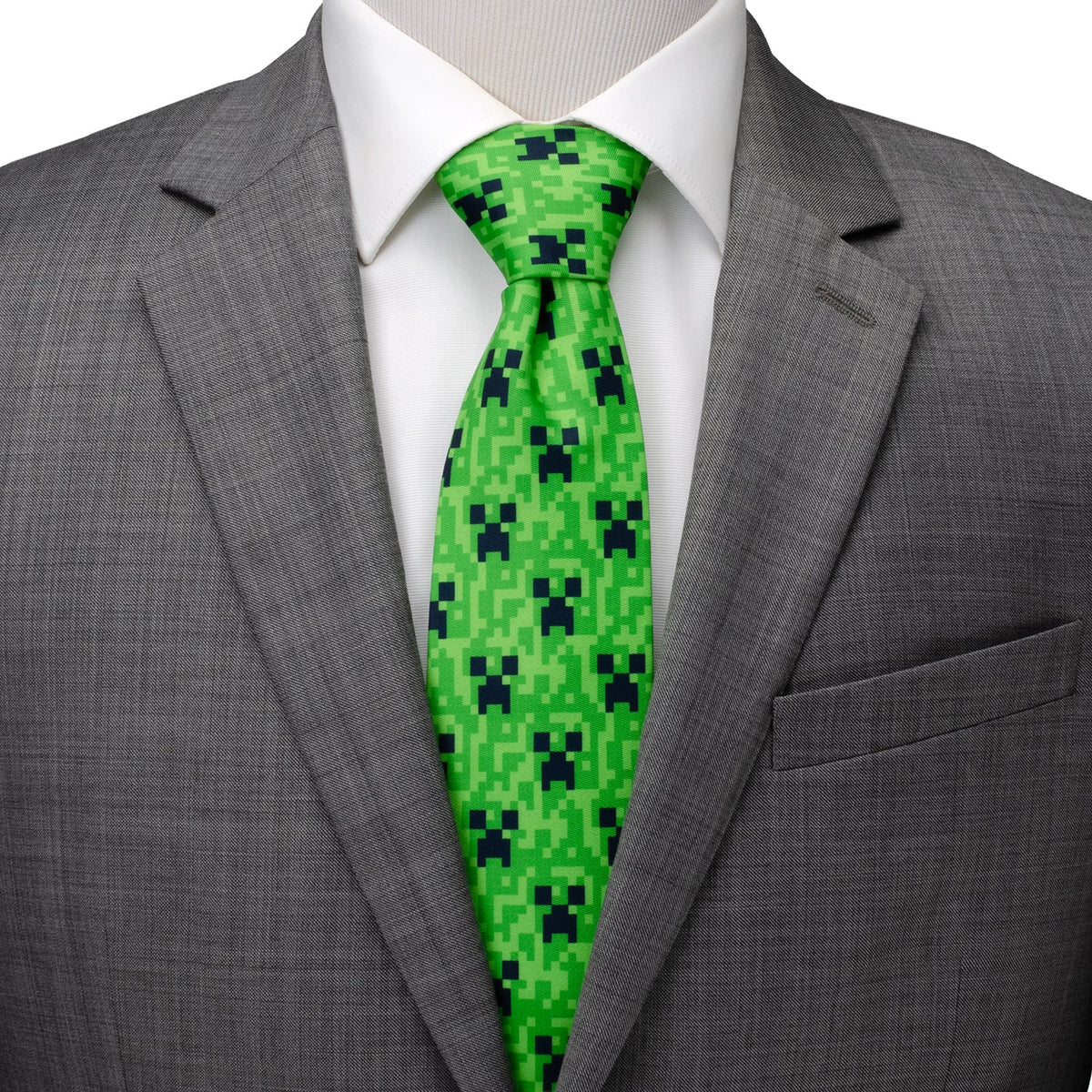 Green pixel camouflage necktie worn with dark suit jacket and white shirt