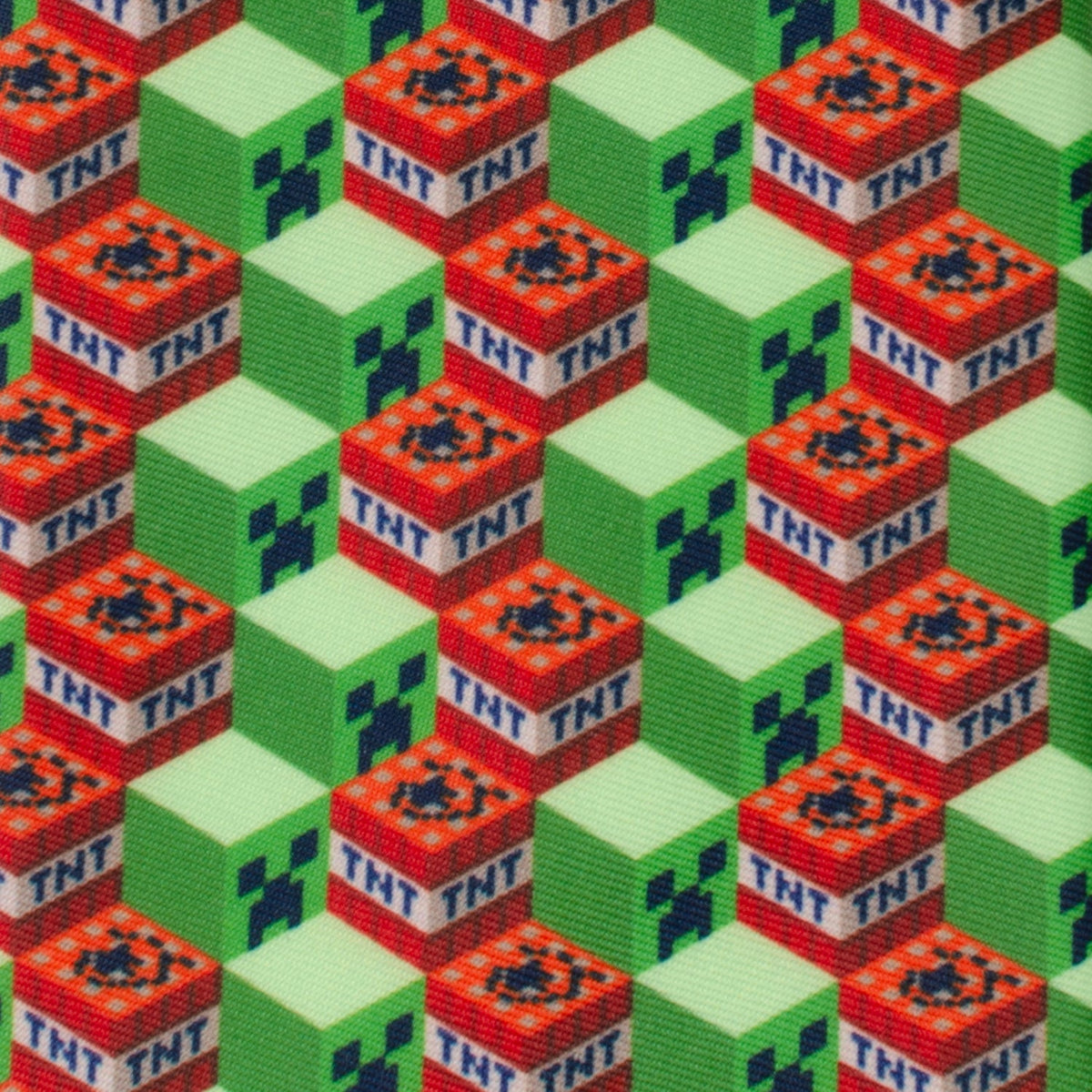 Close-up of green and red TNT cube pattern on a novelty necktie