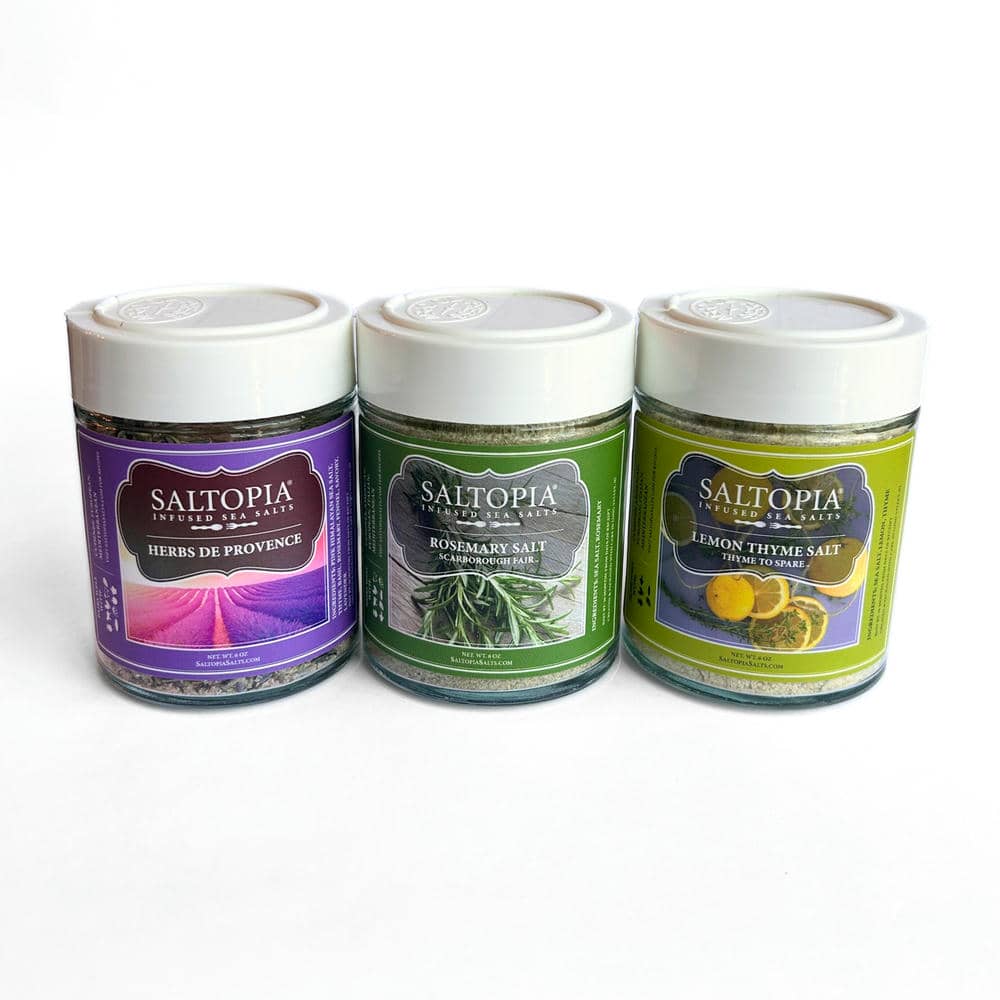 Mediterranean kitchen gift set of three herb seasoning jars with white lids.