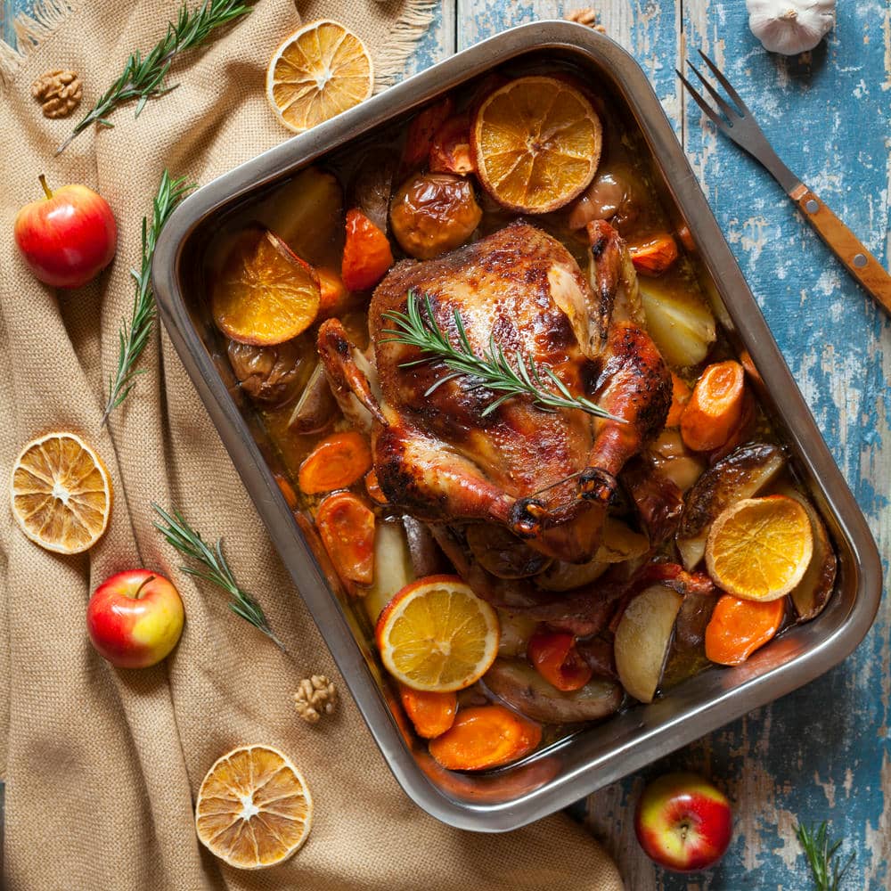 Mediterranean kitchen gift set roasted chicken tray with citrus slices and vegetables.