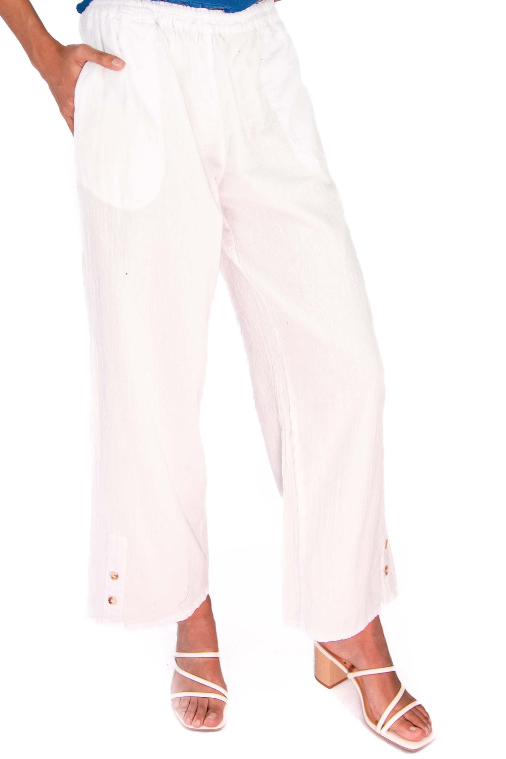 White cotton gauze pants with elastic waist and wide-leg cropped silhouette