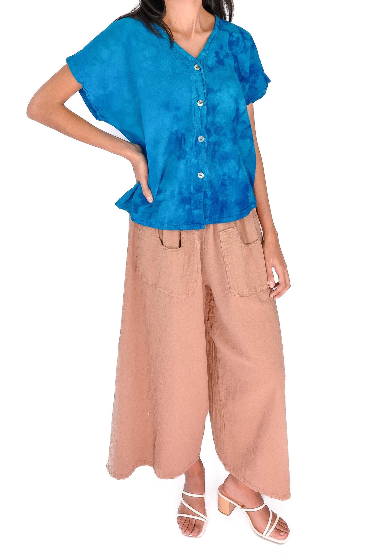 Blue cotton gauze peplum-style top with button-front V-neck
