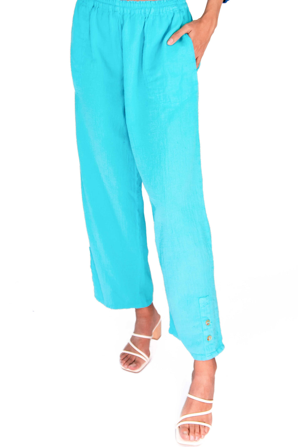 Light blue cotton gauze pants with elastic waist, relaxed wide leg, ankle length, small button hem