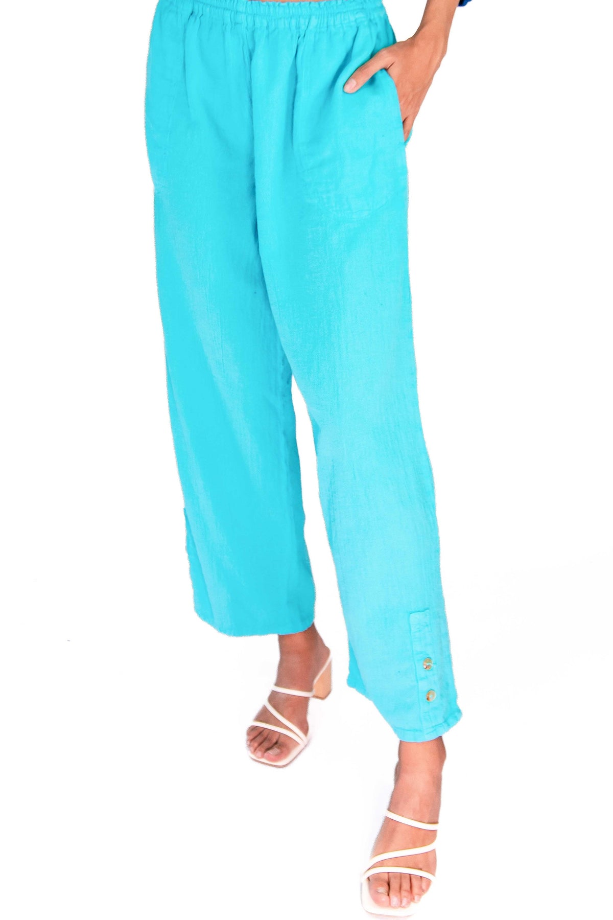 Light blue cotton gauze pants with elastic waist, relaxed wide leg, ankle length, small button hem