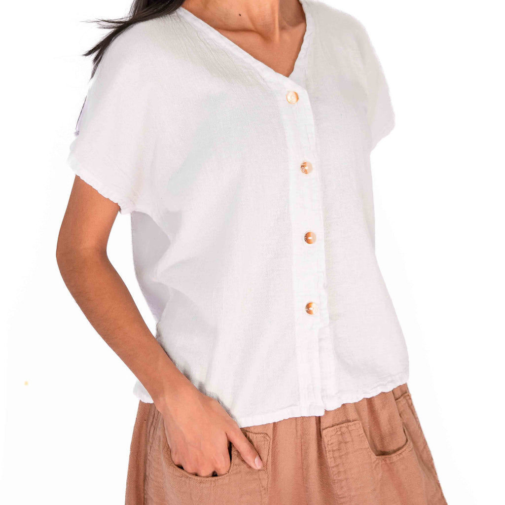 White cotton gauze V-neck top with short sleeves and button placket