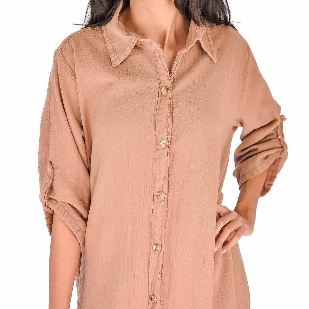 Tan cotton gauze tunic close-up with pointed collar and button placket