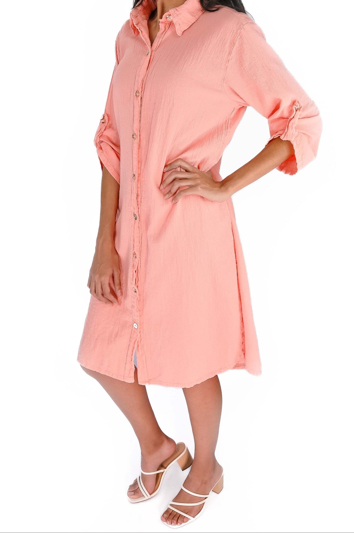 Light pink cotton gauze tunic with pointed collar, button front, and rolled sleeves