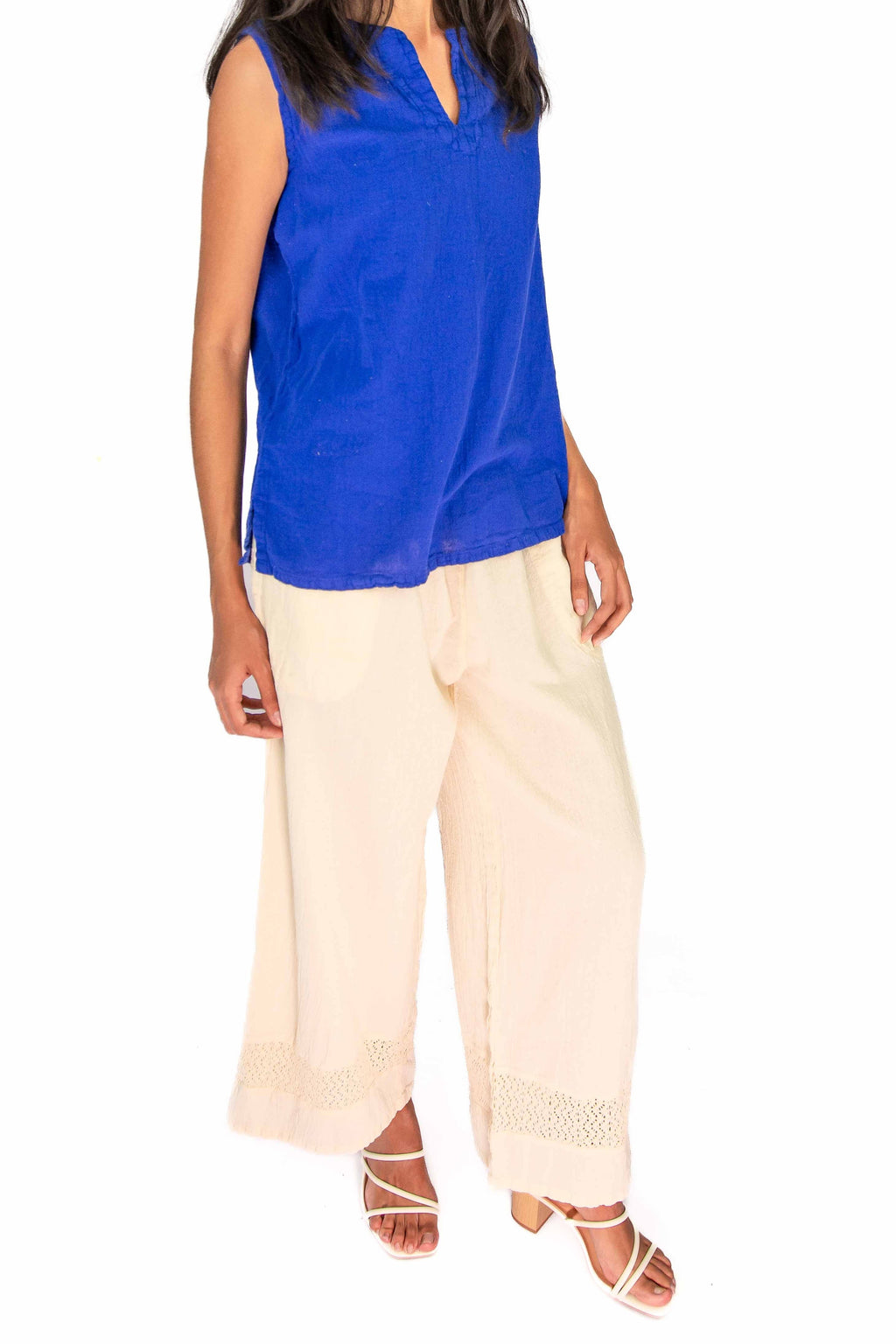 Blue sleeveless cotton gauze top with V-neck and straight hem
