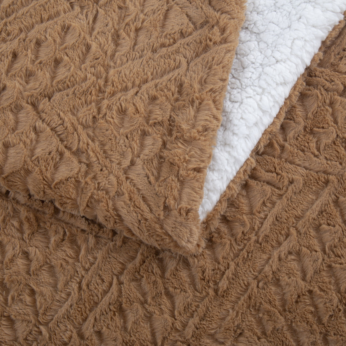 Caramel brown faux fur throw blanket corner with cream sherpa backing