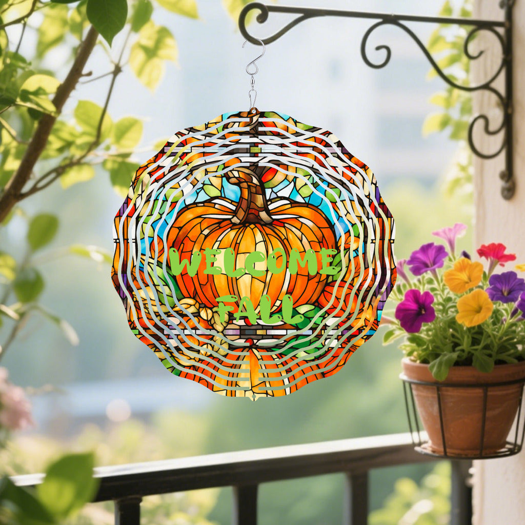 Stained glass style pumpkin wind spinner with multicolor ribbon-like panels and hanging hook