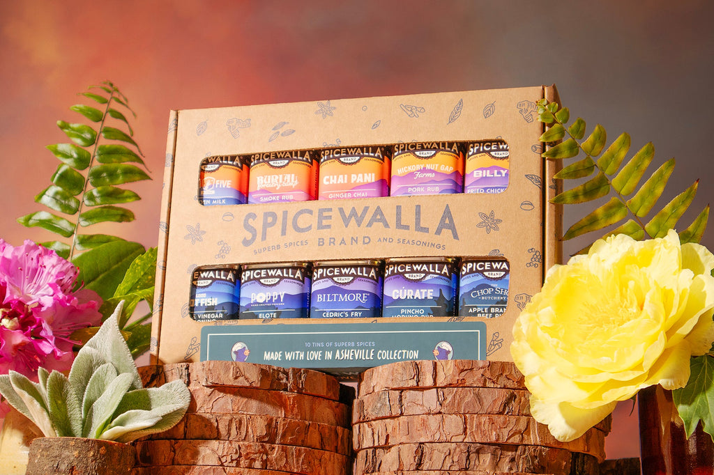 Spicewalla spice gift box with 10 labeled seasoning canisters and brand label
