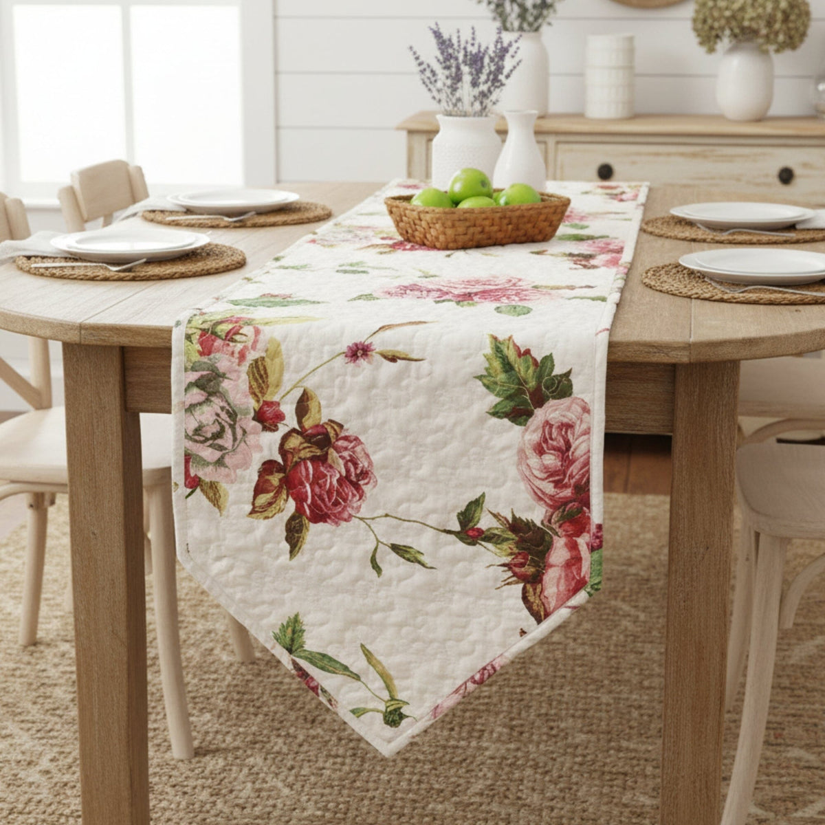 Quilted dining table runner with white fabric and pink rose floral print.