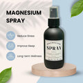Magnesium spray bottle with mist pump and black label on wooden stand