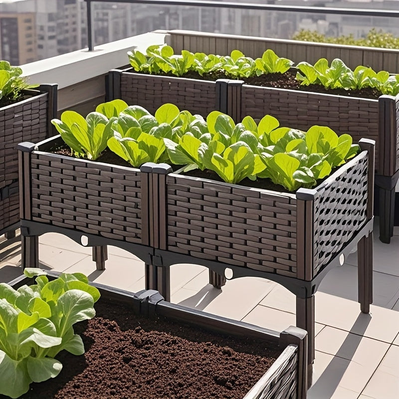 Raised planter bed with dark wicker-style sides and drainage opening on patio