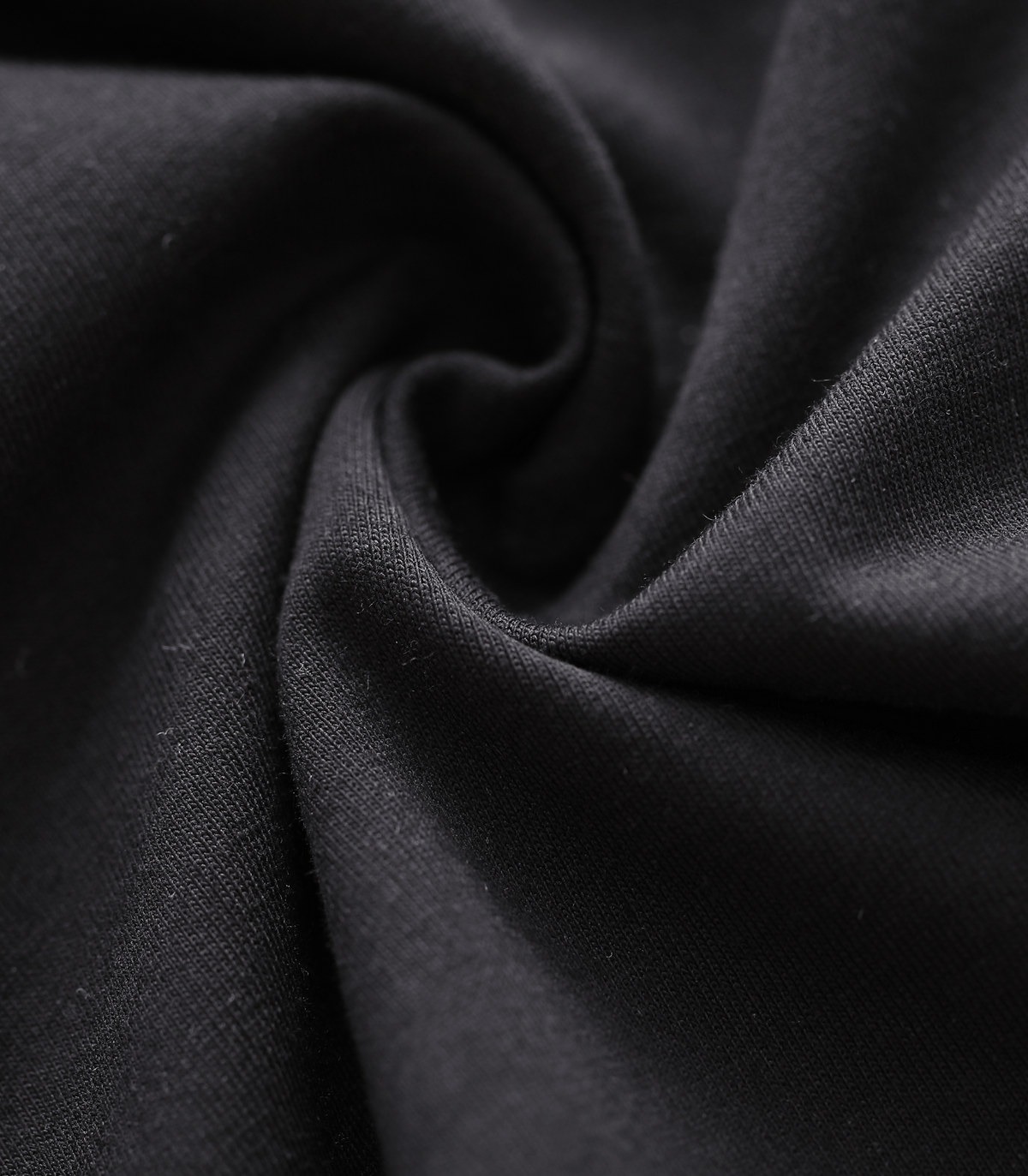 Close-up of dark charcoal knit fabric with smooth, fine texture