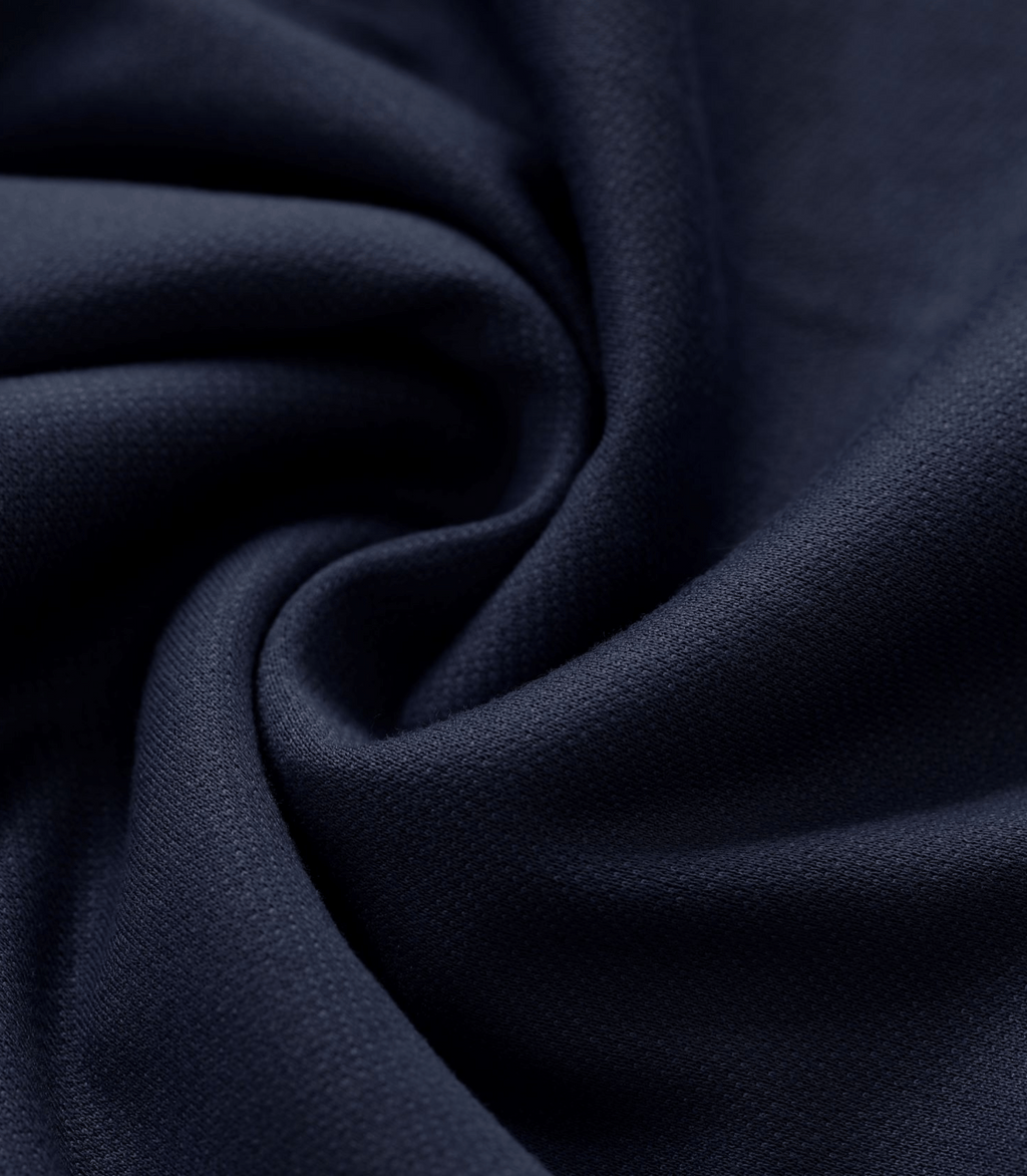Navy maternity trouser fabric close-up with textured knit surface