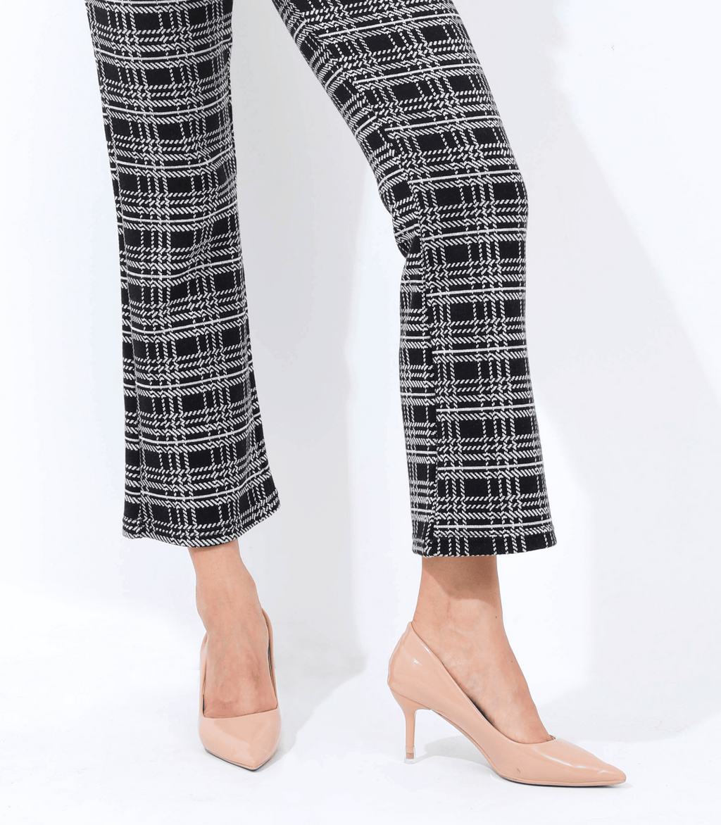 Maternity trouser pant in black-and-white plaid, side view with flared hem