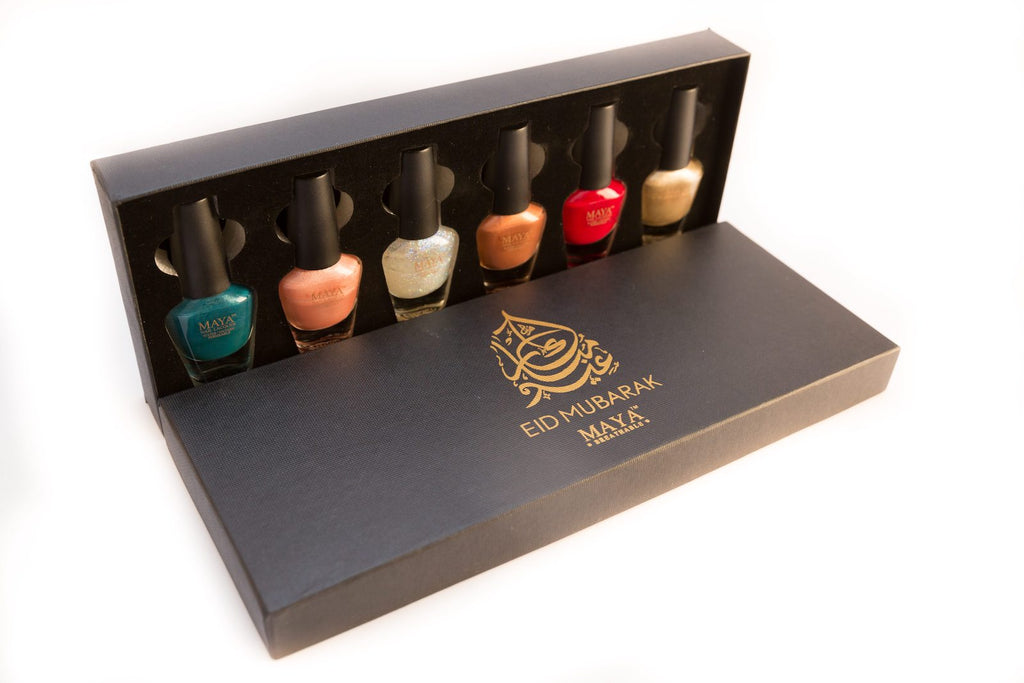 Eid gift set open box with six mini nail polish bottles and Eid Mubarak logo