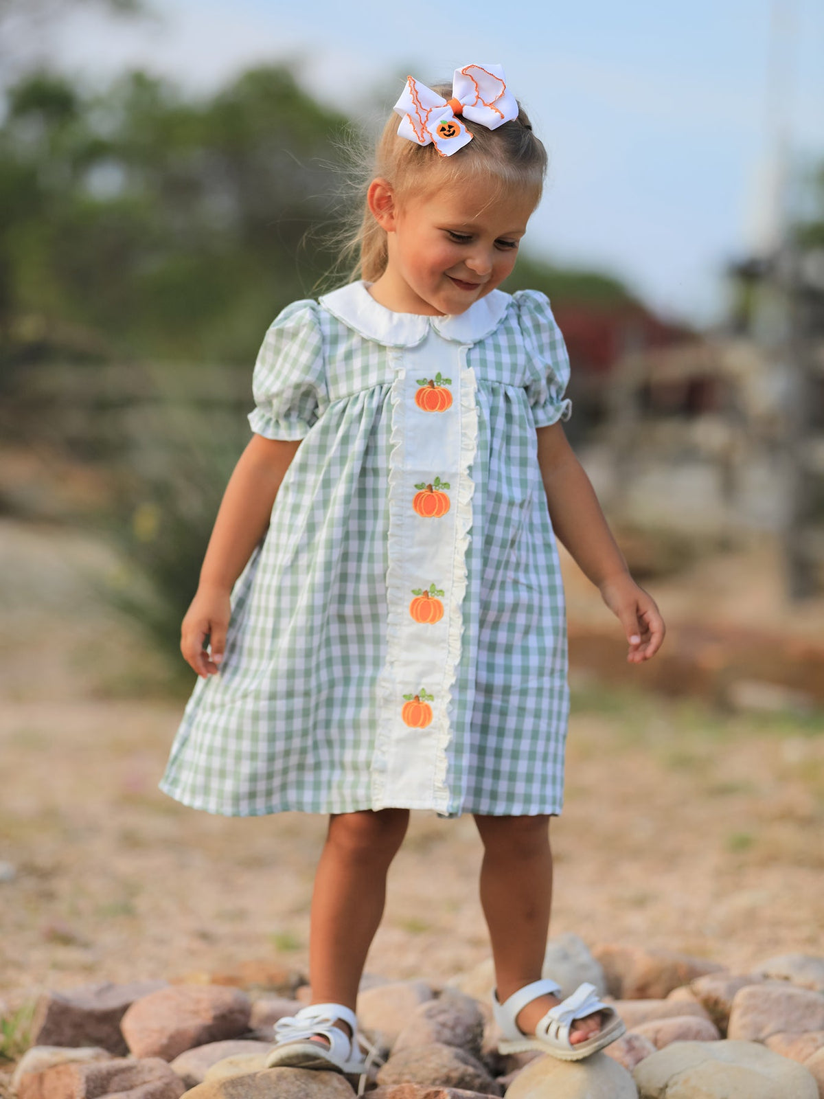 Green gingham girls dress with white ruffle bib and pumpkin applique, puff sleeves